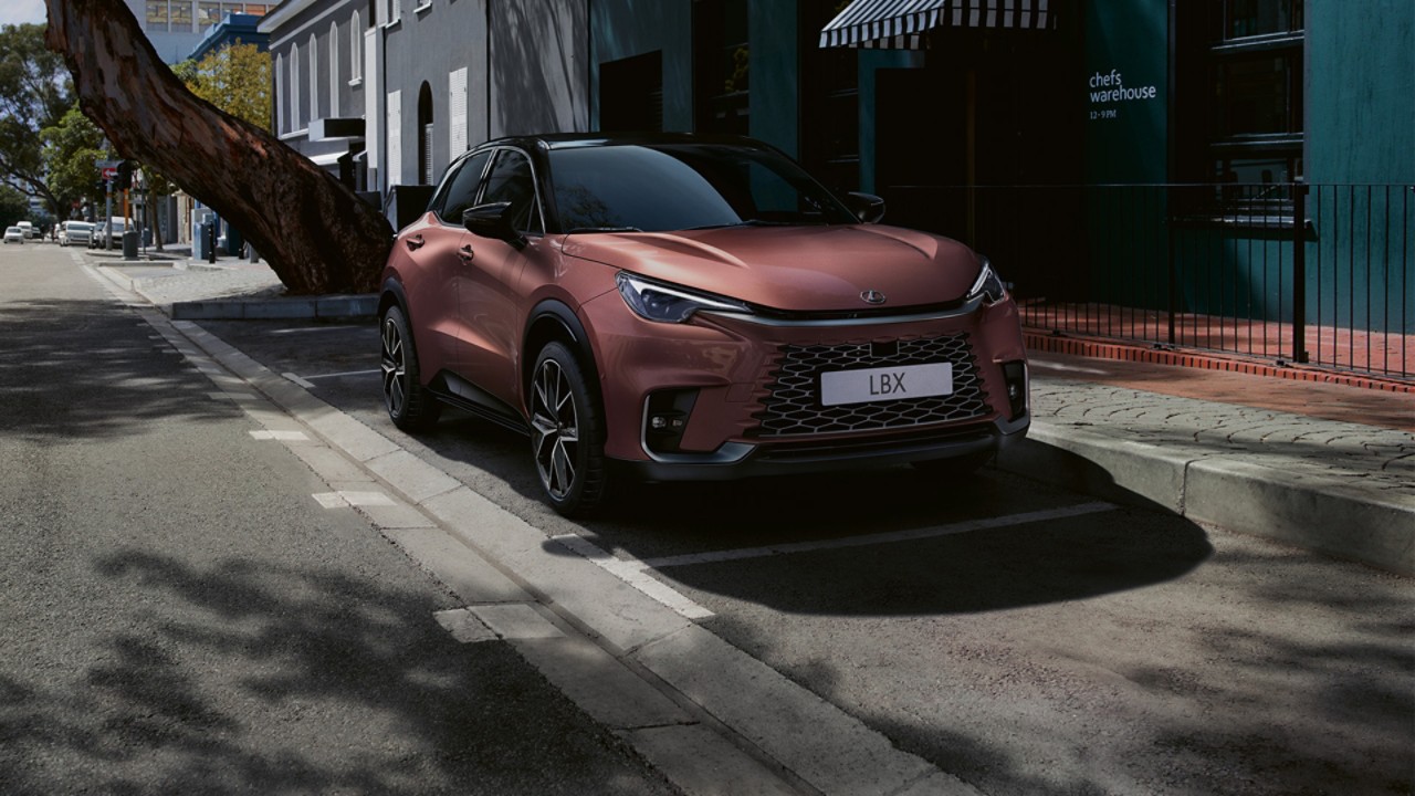 Lexus LBX parked next to a building